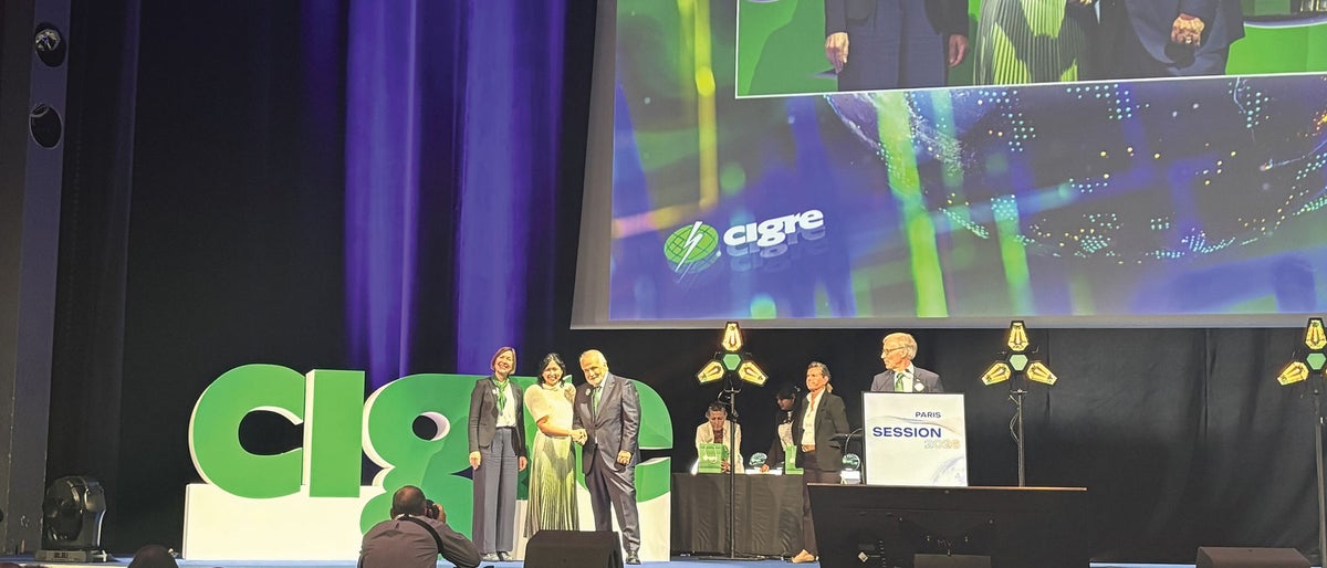Photo courtesy of CIGRE: Aimee Intac-Leung receiving the Women in Energy (WiE) award during CIGRE in Paris, France. 